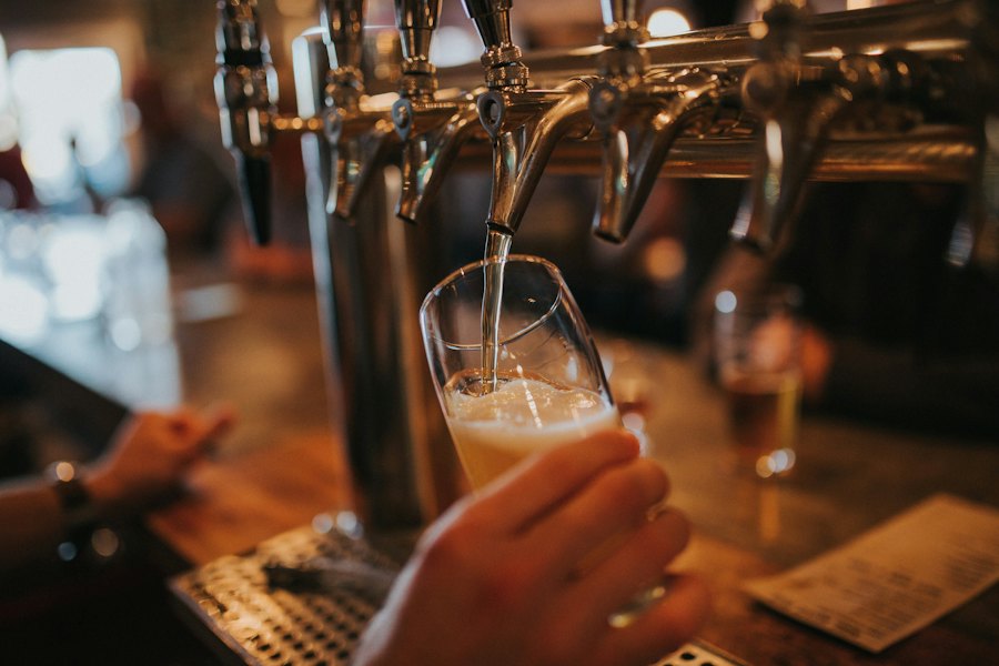 Pouring a beer from the self-serve tap wall