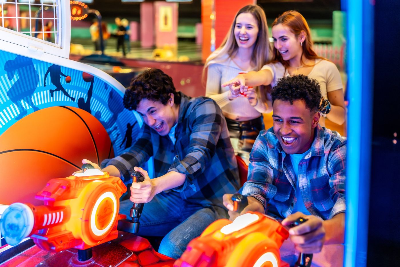 Friends playing arcade games